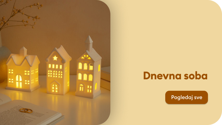 Drvena stolica sa pletenim sjedištem prekrivena bordo ćebetom. Na stolu su šolja, zdjela sa orasima i dekorativni tanjir. U pozadini je polica sa knjigama i ukrasima. Tekst pored slike: 