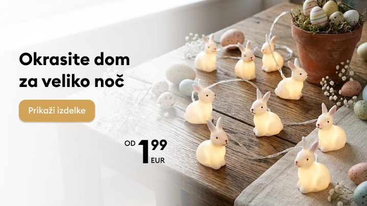 Promocija velikonočnih okraskov za dom, z osvetljenimi zajčki, ki vabijo k ogledu in nakupu izdelkov za praznično okrasitev.