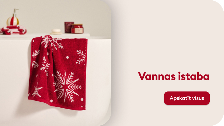 Vannas istabas attēls, kur centrā redzams balts priekšmets ar uzkārtu sarkanu dvieli, rotātu sniegpārsliņu motīviem. Fons rāda vannas istabas aksesuārus. Uzraksts "Vannas istaba" un poga "Apskatīt visus". Piemērots svētku noskaņām vai dāvanām.